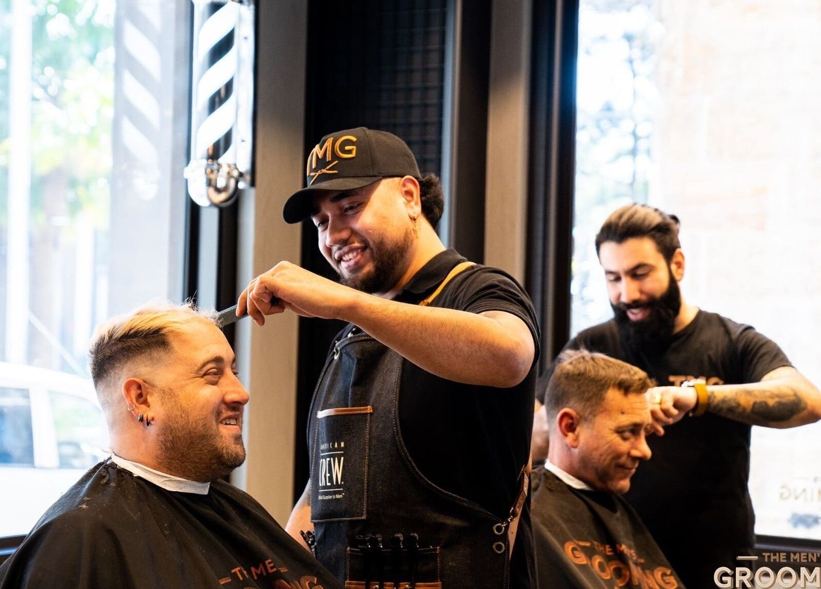 Barbers styling at The Men's Grooming Circular Quay Gateway, Sydney, New South Wales, AU.