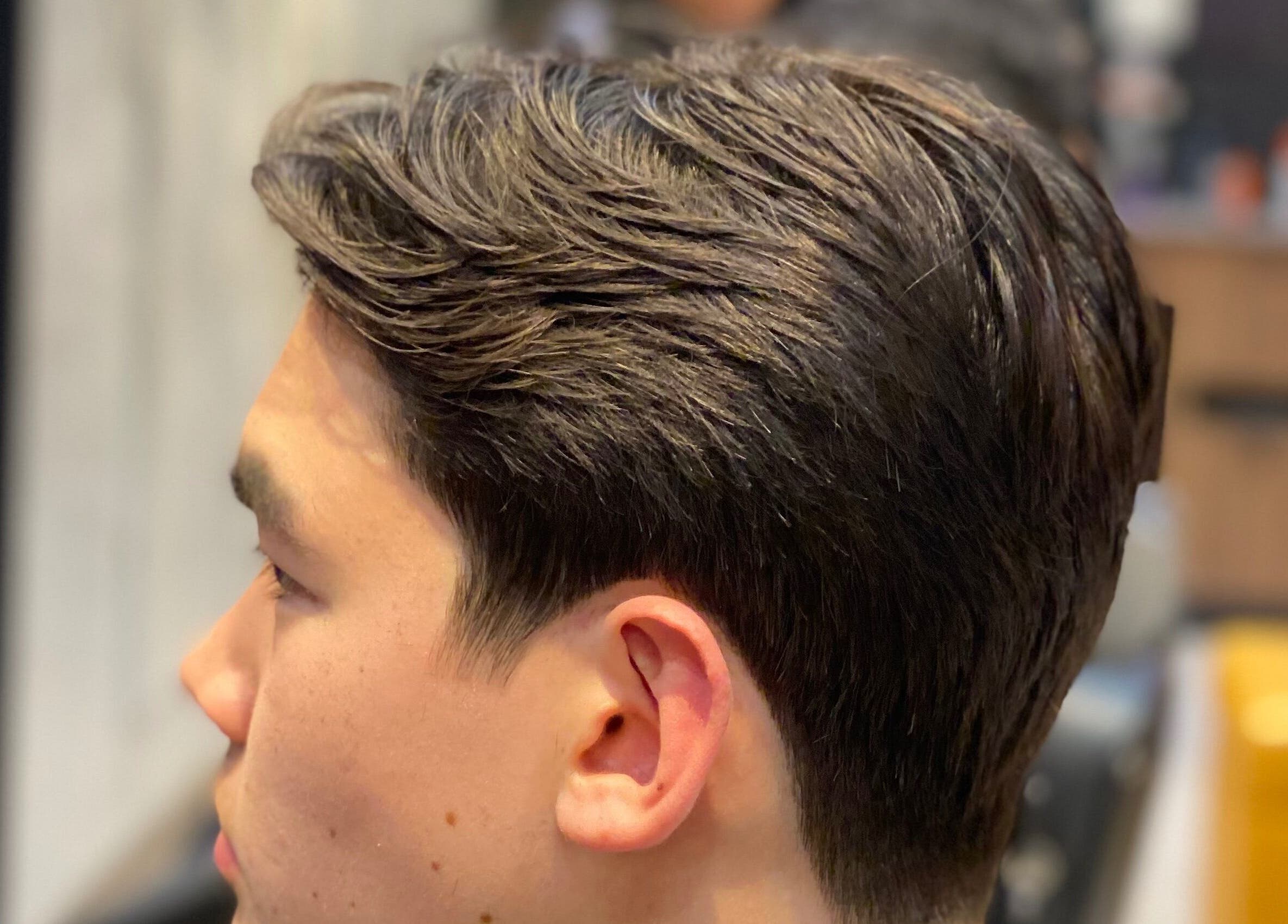 Close-up of a stylish haircut at The Men's Grooming Circular Quay Gateway, Sydney, New South Wales, AU.