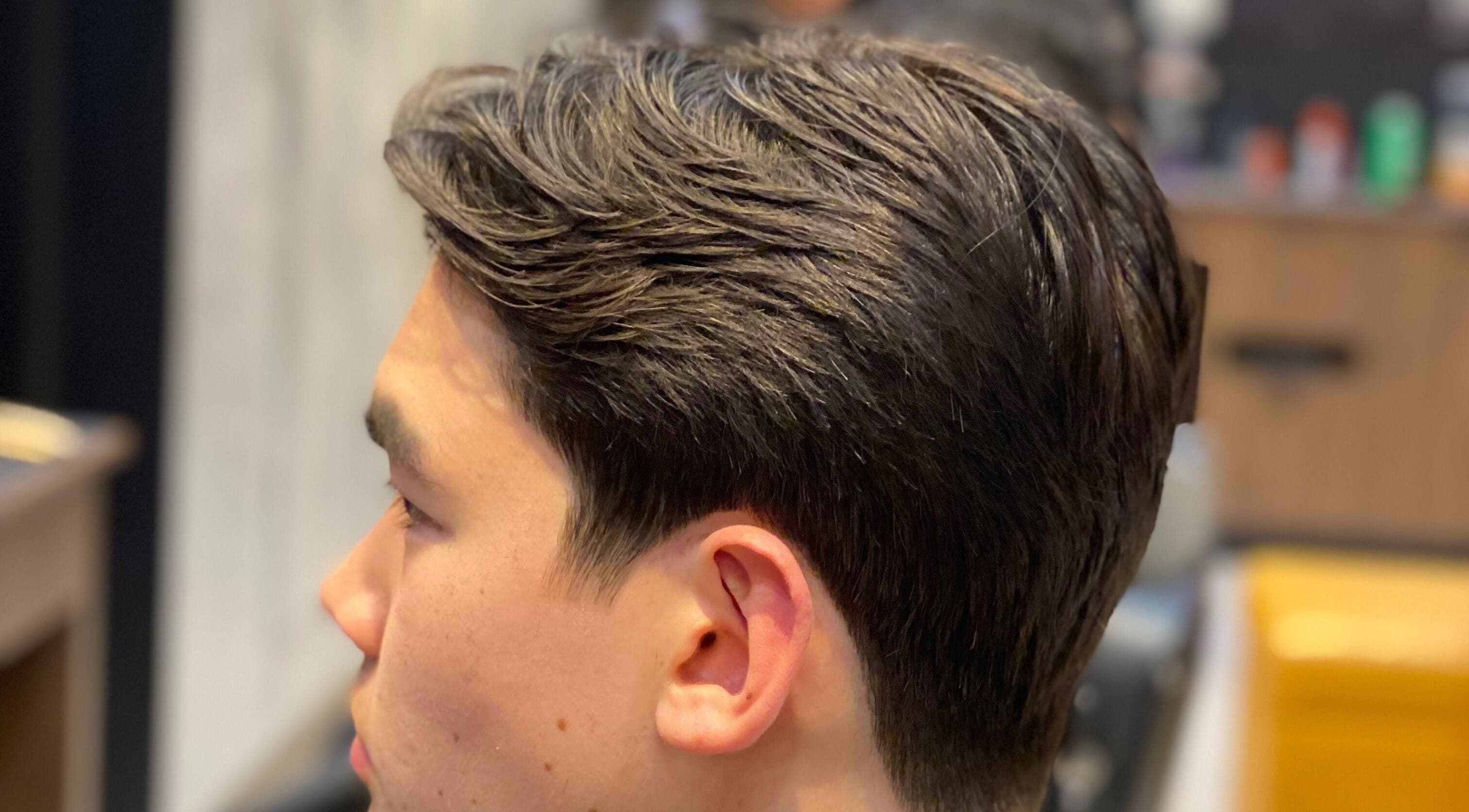 Close-up of a stylish haircut at The Men's Grooming Circular Quay Gateway, Sydney, New South Wales, AU.