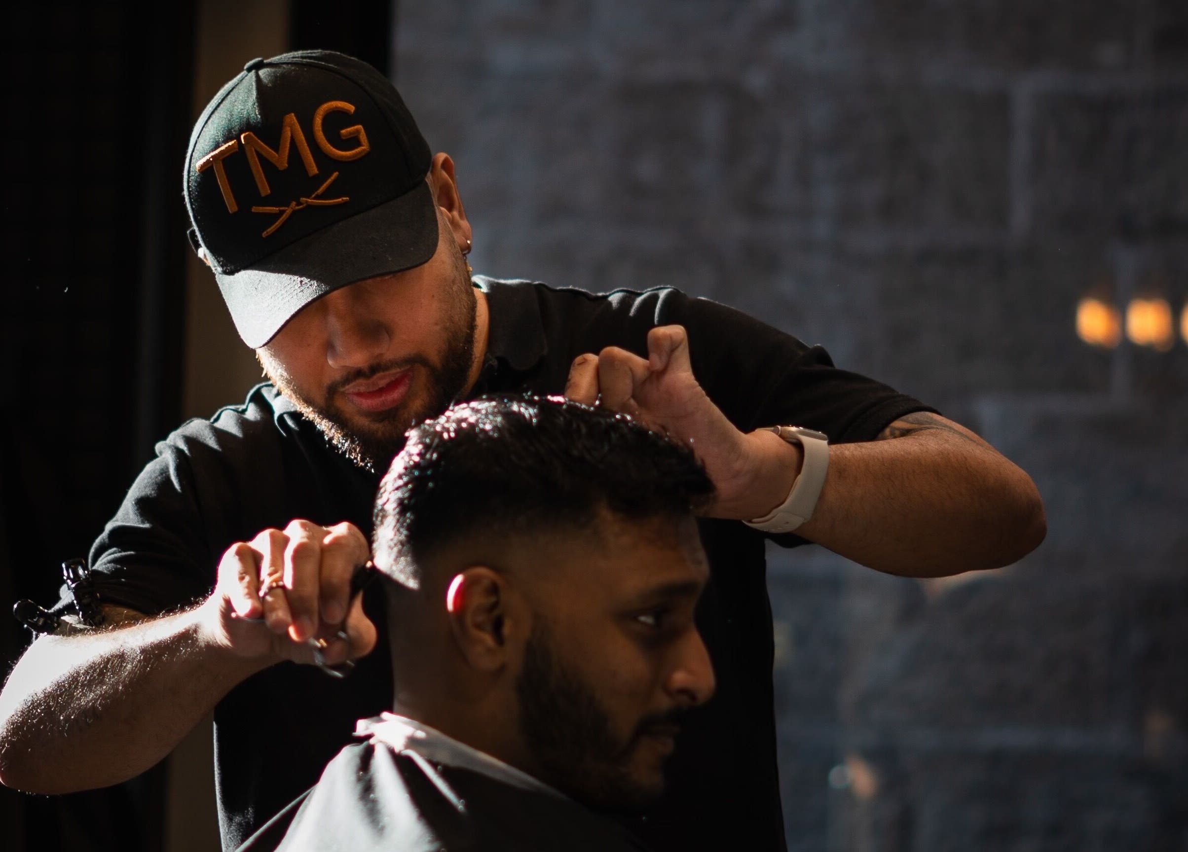 Barber crafting a haircut at The Men's Grooming Circular Quay Gateway, Sydney, New South Wales, AU.