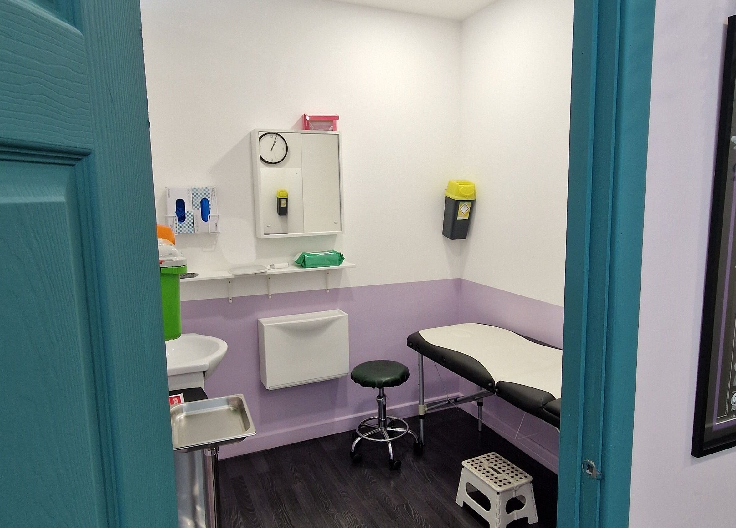 Interior of Forest Piercing with treatment bed and equipment in Glasgow, Scotland, GB.