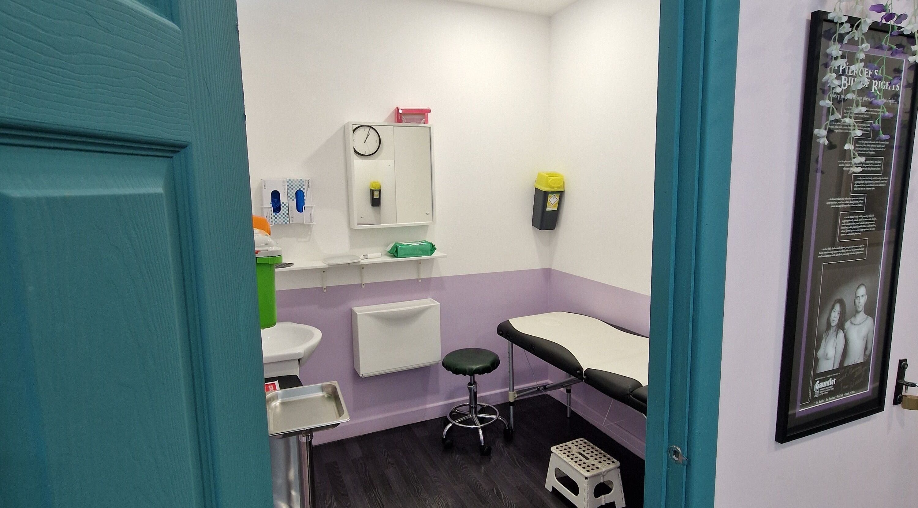 Interior of Forest Piercing with treatment bed and equipment in Glasgow, Scotland, GB.