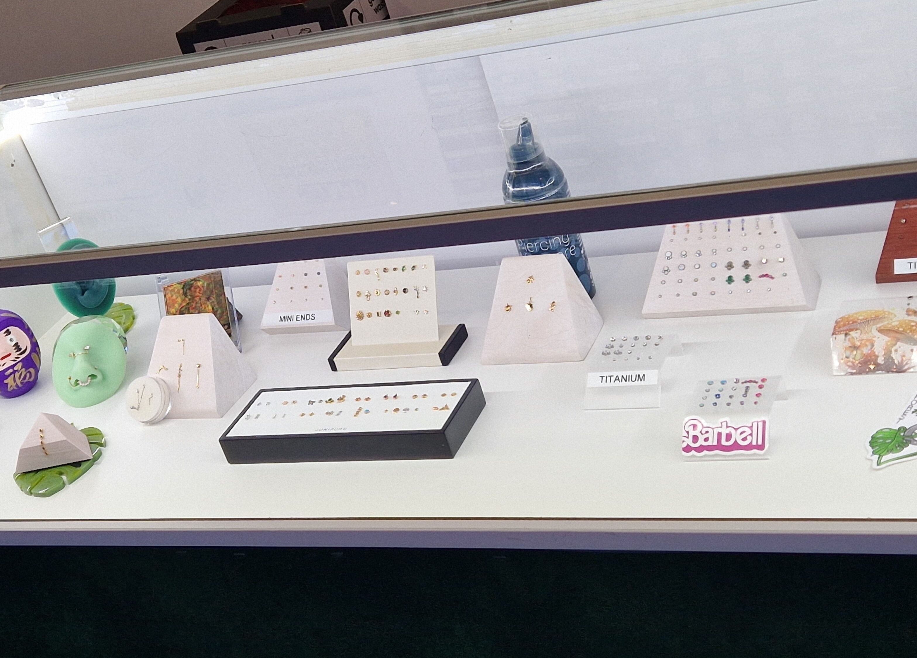 Showcase of elegant piercing jewelry at Forest Piercing, Glasgow, Scotland, GB.