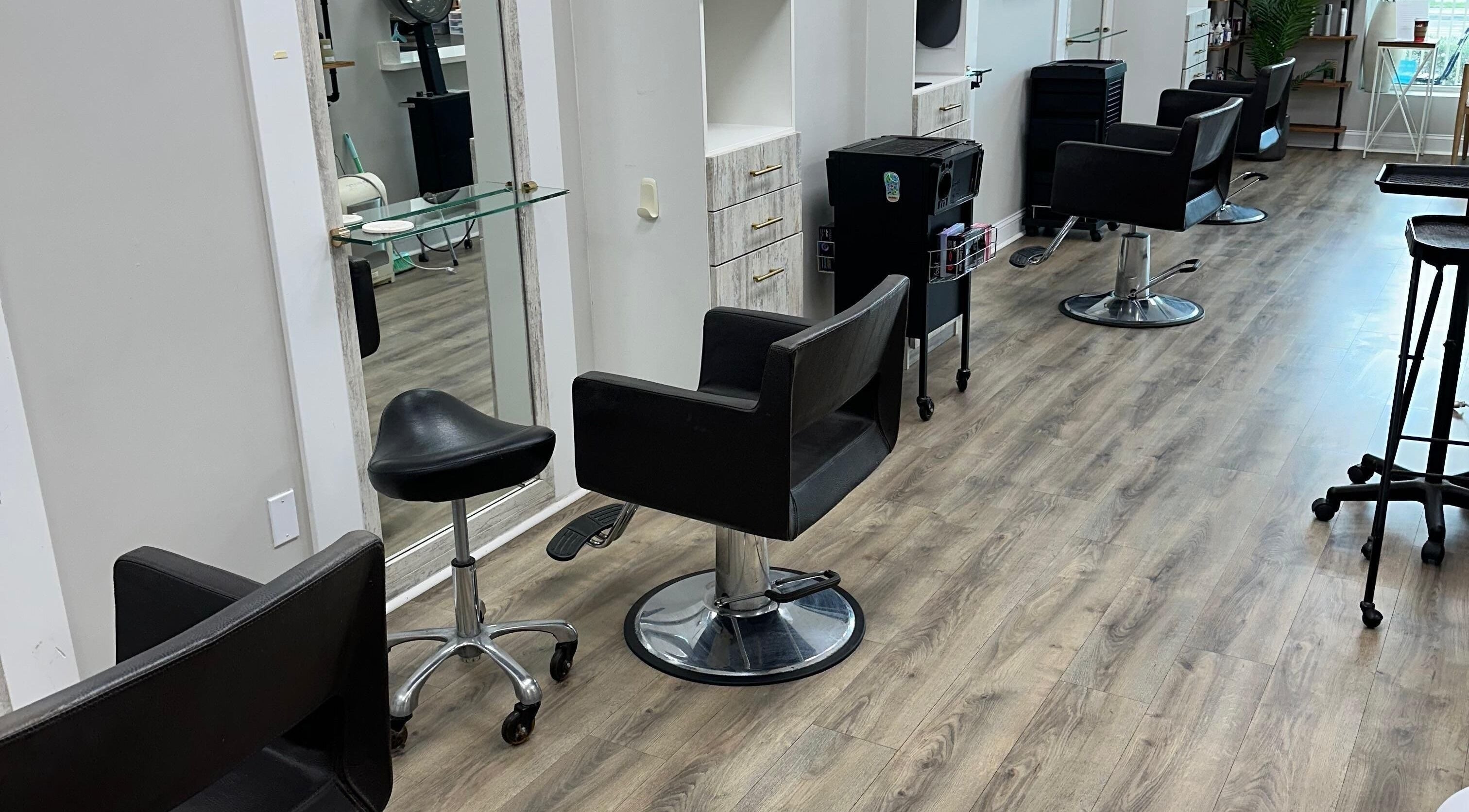 Modern styling chairs at Studio 34 Hair Salon - Boynton Beach, Florida, US, showcasing sleek salon design.