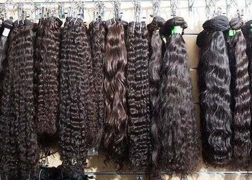 Variety of wavy hair extensions displayed at HairPlusTT, Port of Spain, Port of Spain Corporation, TT.