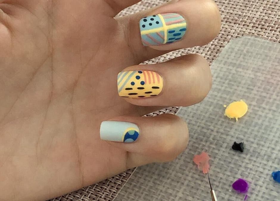 Colorful nail art design on hand at Better Nails, Singapore, Singapore, SG.
