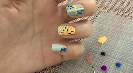 Colorful nail art design on hand at Better Nails, Singapore, Singapore, SG.