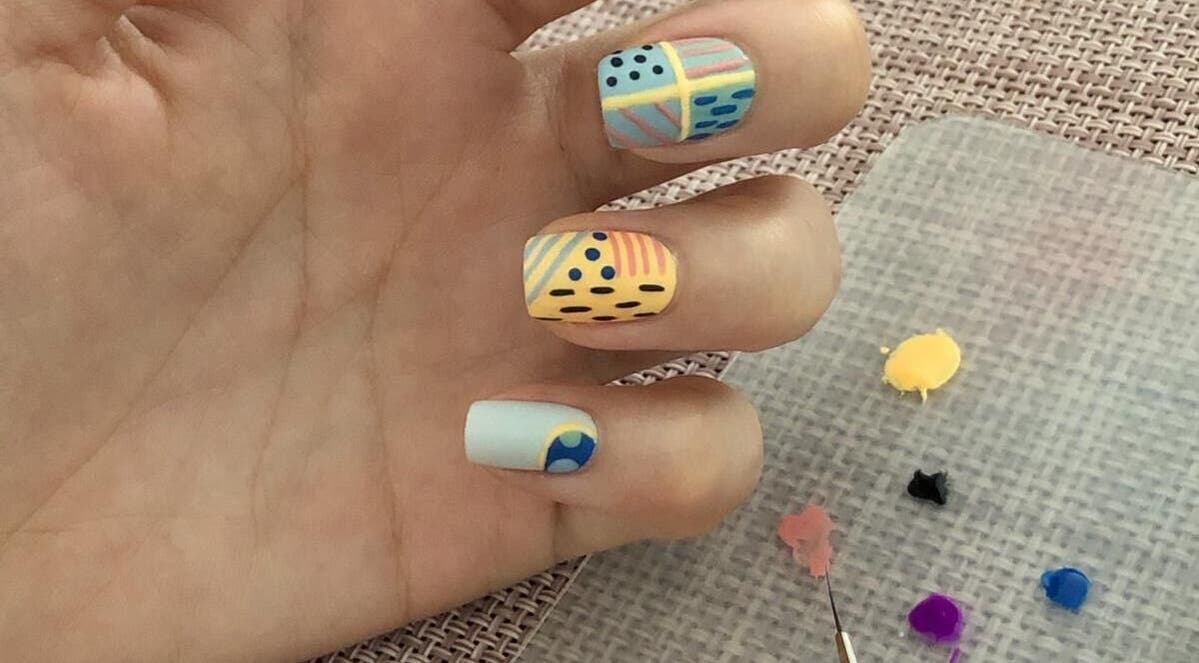 Colorful nail art design on hand at Better Nails, Singapore, Singapore, SG.