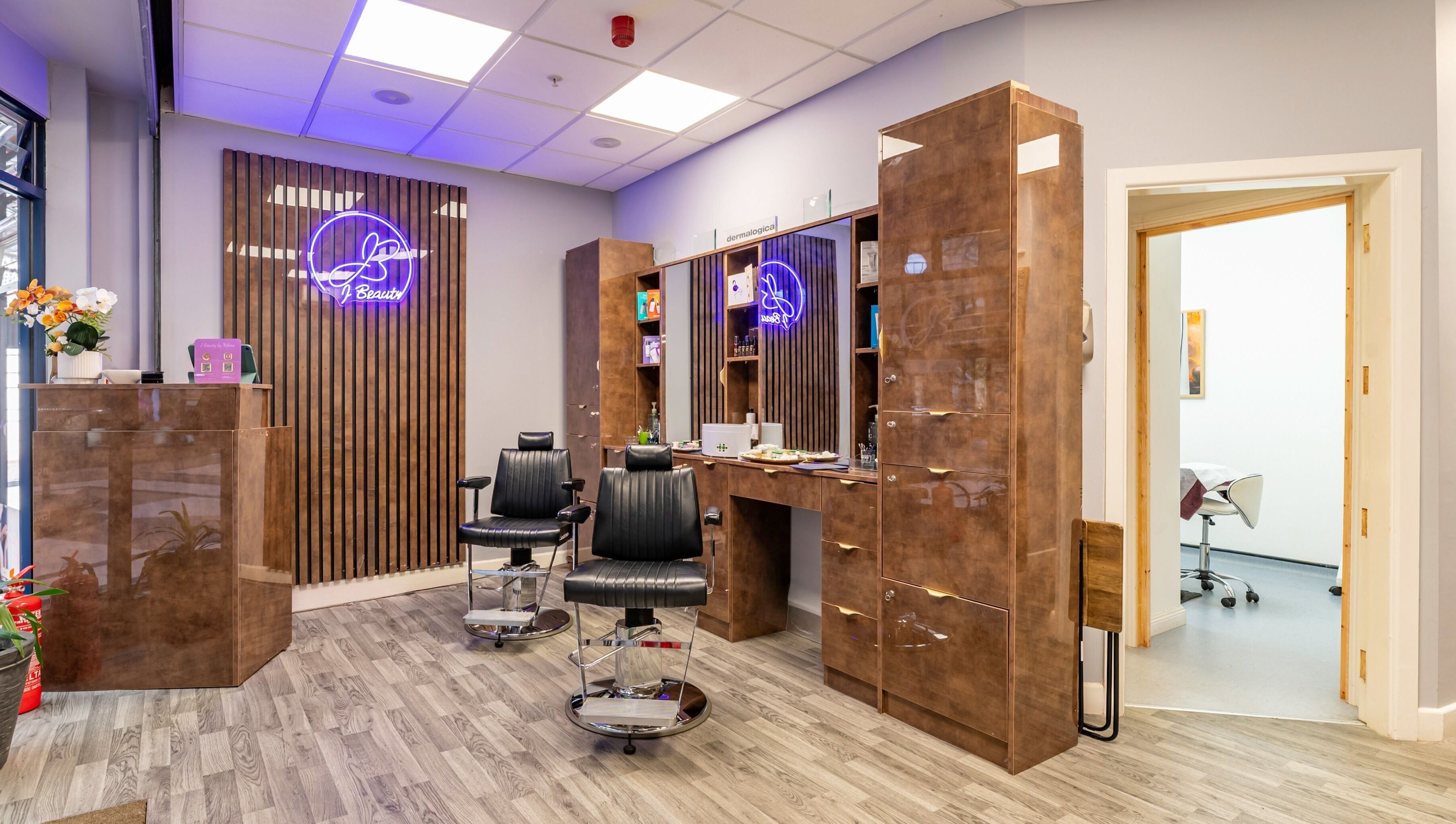Modern salon chairs and decor at J Beauty by Nilima in Birmingham, England, GB.