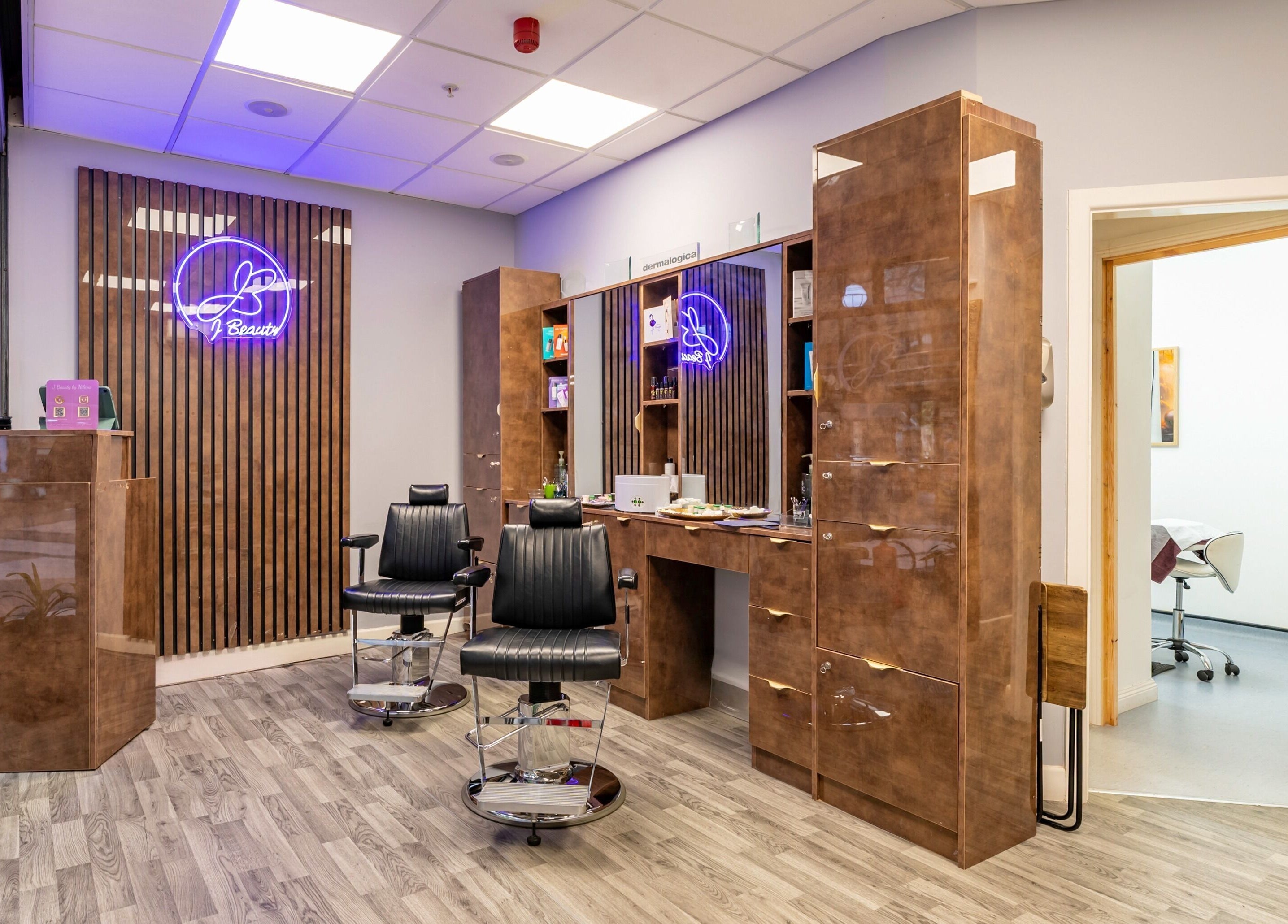 Modern salon chairs and decor at J Beauty by Nilima in Birmingham, England, GB.
