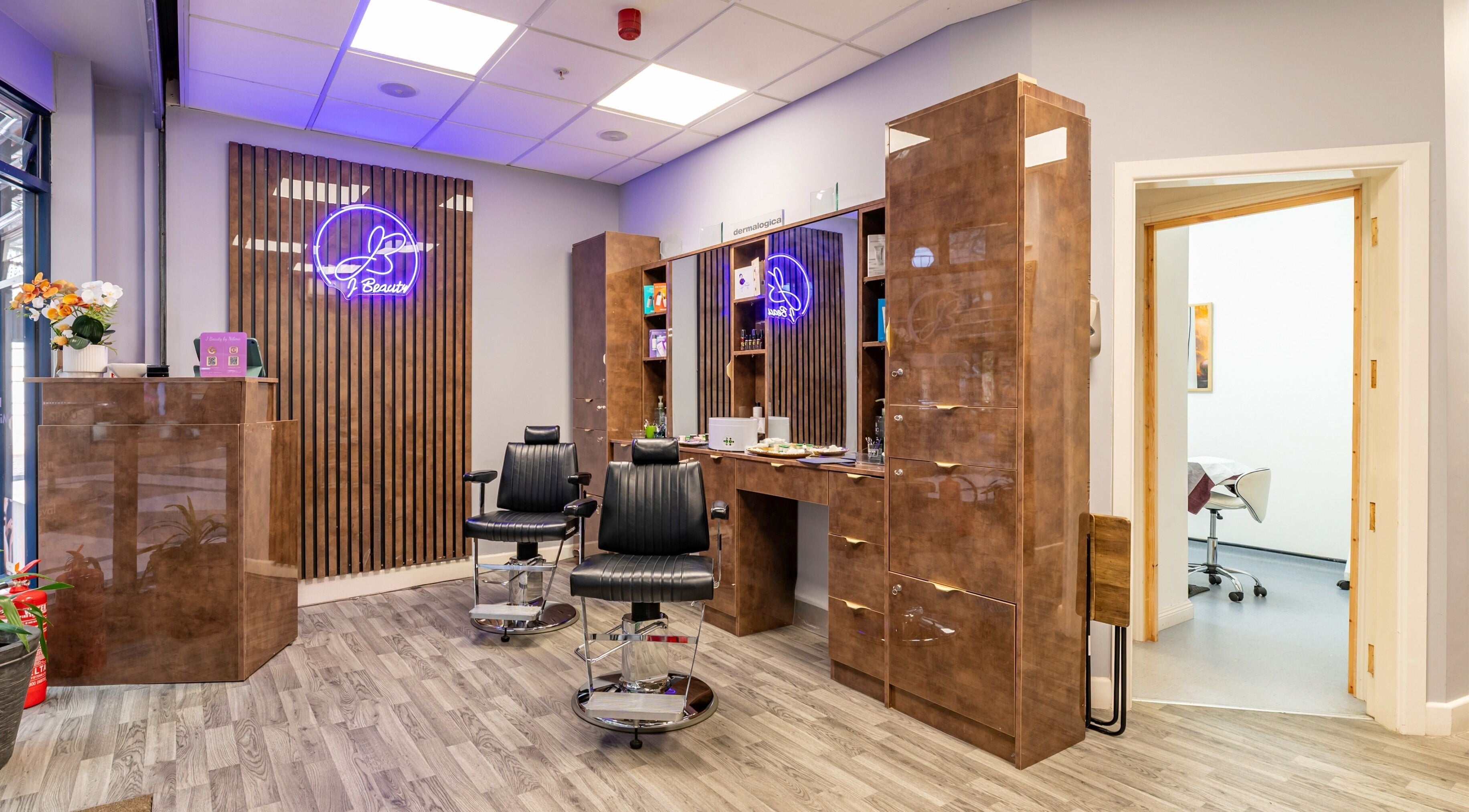 Modern salon chairs and decor at J Beauty by Nilima in Birmingham, England, GB.