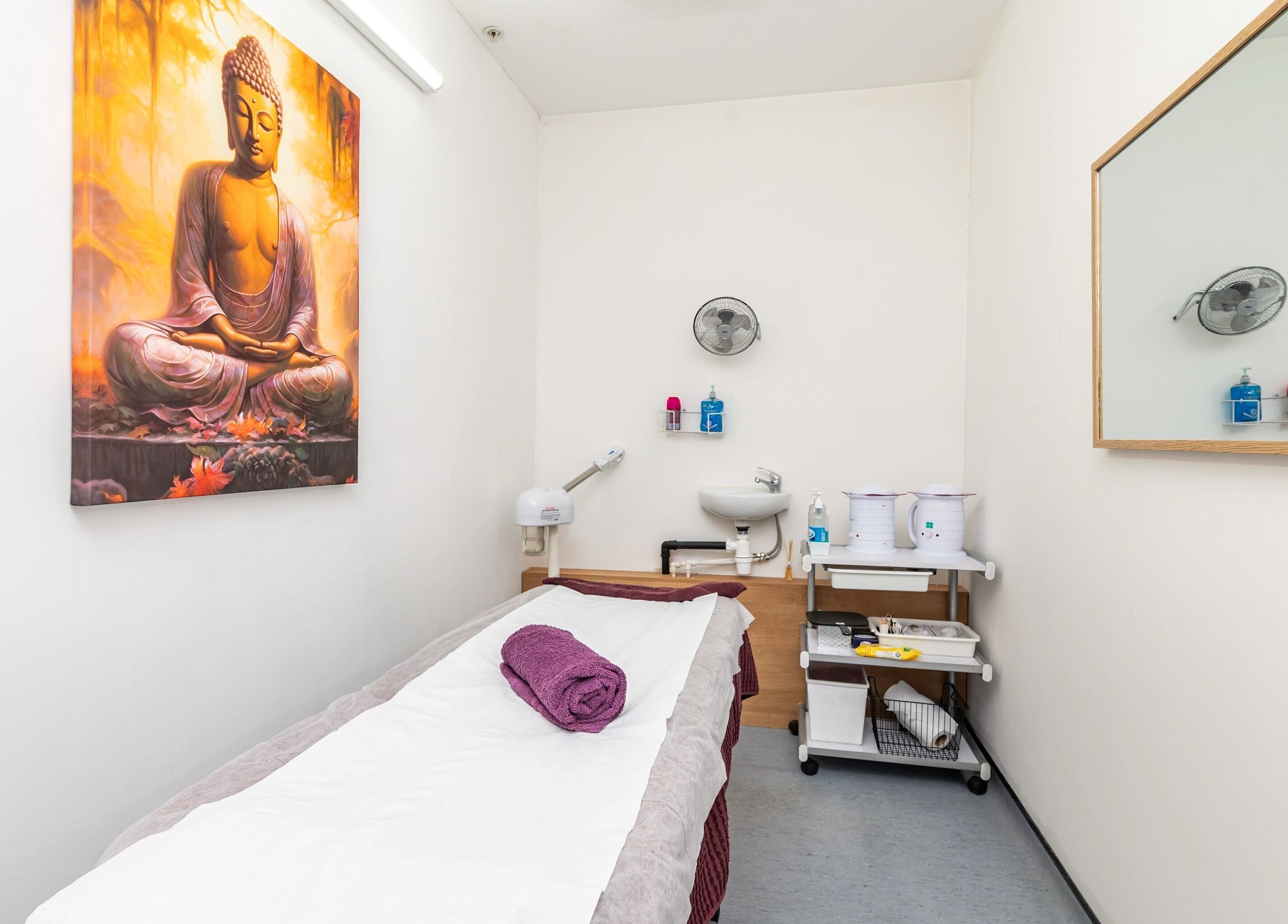 Tranquil treatment room at J Beauty by Nilima, Birmingham, England, GB with calming decor and spa essentials.