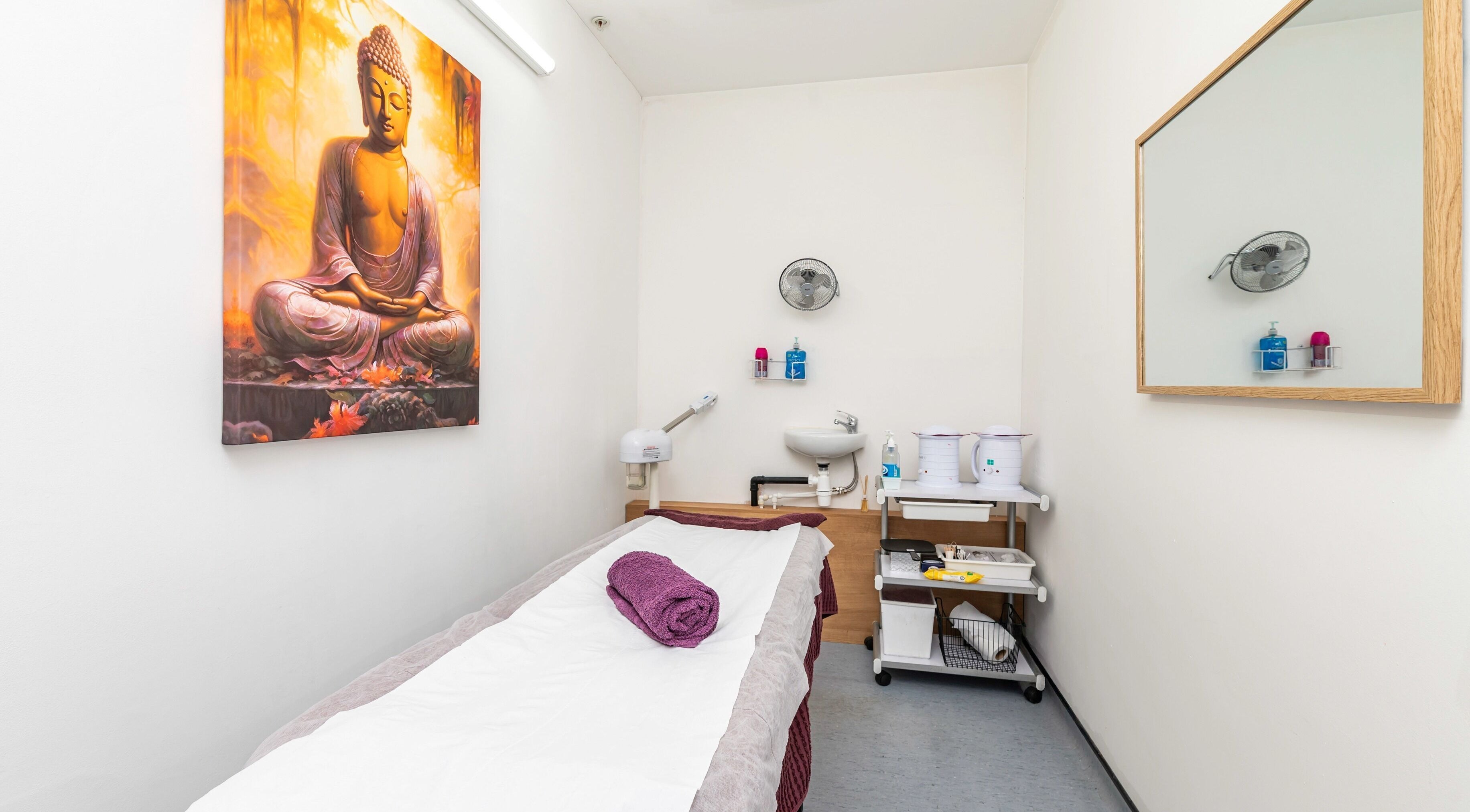 Tranquil treatment room at J Beauty by Nilima, Birmingham, England, GB with calming decor and spa essentials.