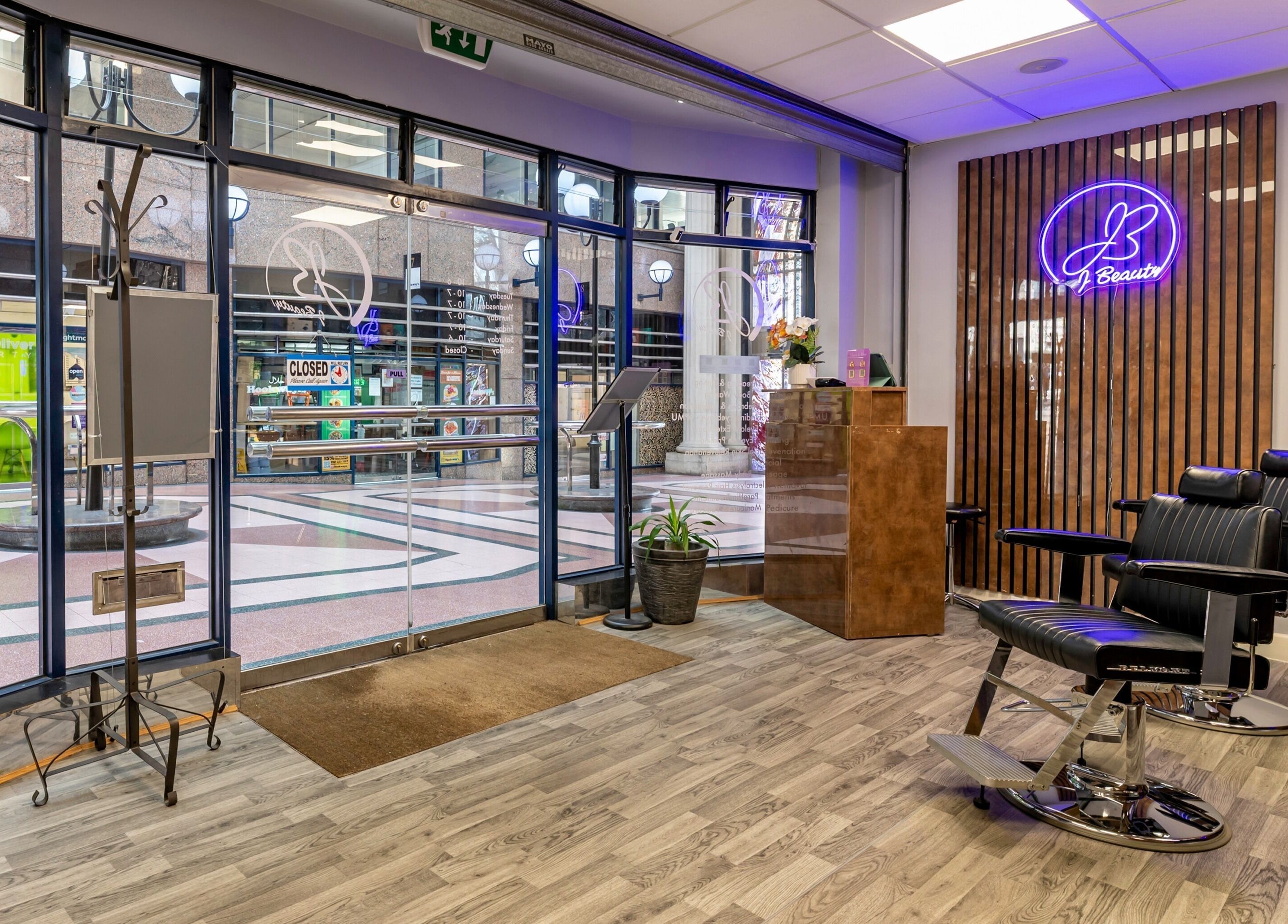 Modern interior of J Beauty by Nilima in Birmingham, England, GB features stylish chairs and bright decor.