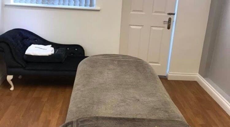 Relaxing treatment room at Riverside Beauty in Titchfield, England, GB with plush seating and soft lighting.