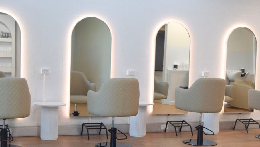 Modern salon chairs and illuminated mirrors at Hair by Jessie - Hervey Bay, Pialba, Queensland, AU.