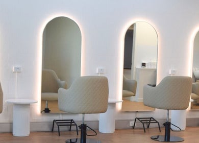 Modern salon chairs and illuminated mirrors at Hair by Jessie - Hervey Bay, Pialba, Queensland, AU.