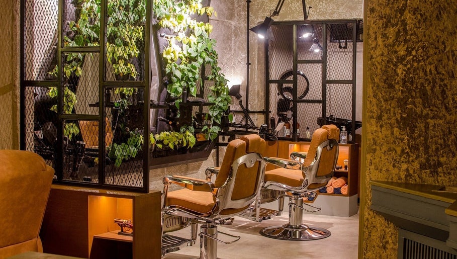 Luxury salon chairs at The Lair Man, Mumbai, Maharashtra, IN with stylish decor and ambient lighting.