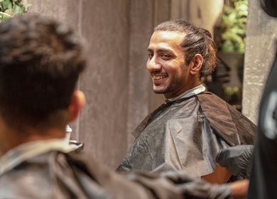 Happy client at The Lair Man salon in Mumbai, Maharashtra, IN, enjoying a grooming session.