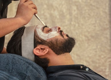 A man enjoys a rejuvenating facial treatment at The Lair Man, Mumbai, Maharashtra, IN.