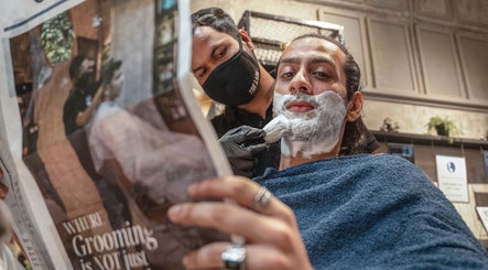 Client enjoys shave at The Lair Man, a top grooming spot in Mumbai, Maharashtra, IN.