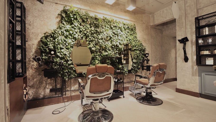 Chic salon interior with green wall at The Lair Man, Mumbai, Maharashtra, IN, offering a refreshing ambiance.
