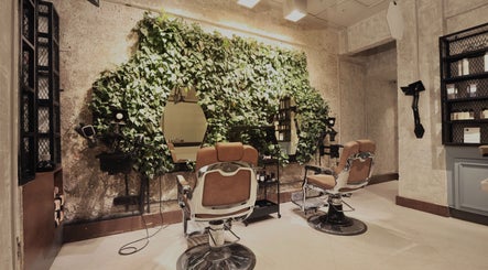 Chic salon interior with green wall at The Lair Man, Mumbai, Maharashtra, IN, offering a refreshing ambiance.