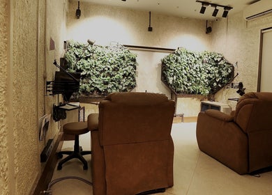 Luxurious lounge area with plants at The Lair Man, Mumbai, Maharashtra, IN, offering a serene ambiance.