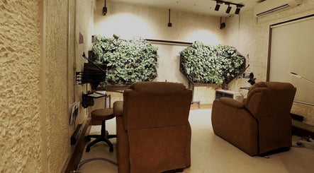 Luxurious lounge area with plants at The Lair Man, Mumbai, Maharashtra, IN, offering a serene ambiance.