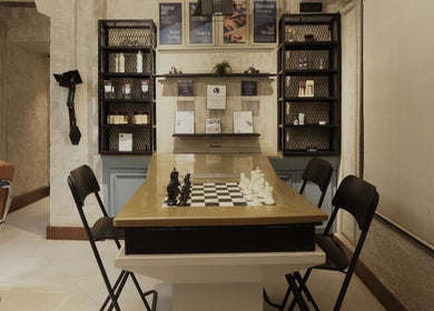 Cozy relaxation area with a chessboard at The Lair Man, Mumbai, Maharashtra, IN.