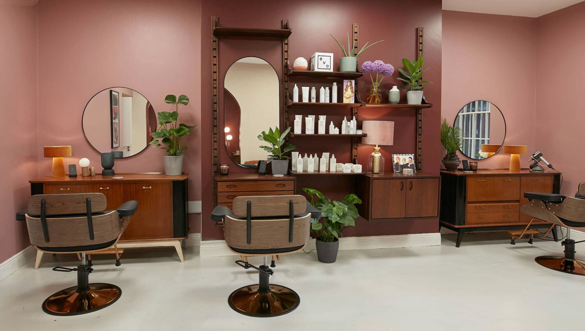 Elegant salon setup at Aidan Darcy • Hair, Dublin 2, IE with vintage chairs and stylish decor.