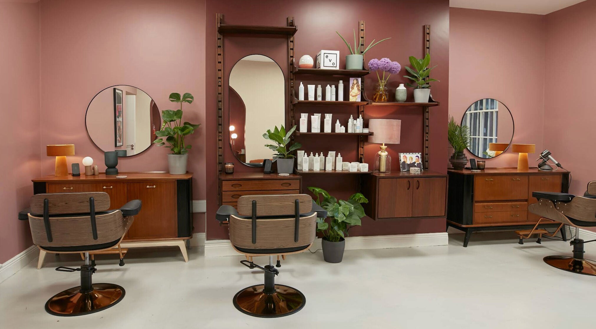 Elegant salon setup at Aidan Darcy • Hair, Dublin 2, IE with vintage chairs and stylish decor.