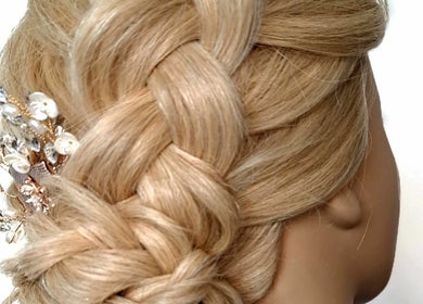 Elegant braided hairstyle with pearl adornments at The Hair Lodge, Wakefield, England, GB.