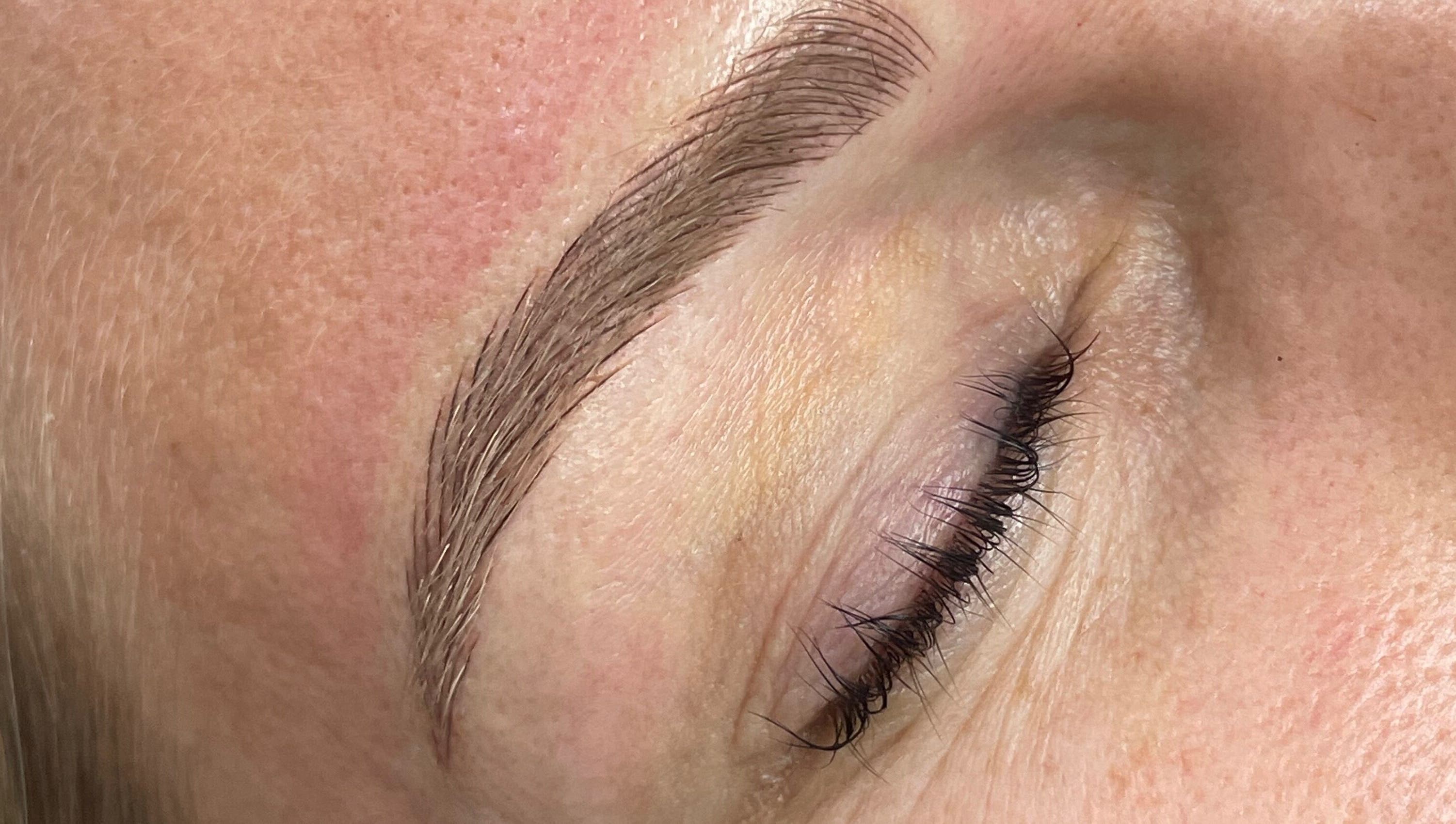 Close-up of professionally groomed eyebrow at Allure Lashes & Aesthetics, Sandton, Gauteng, ZA.