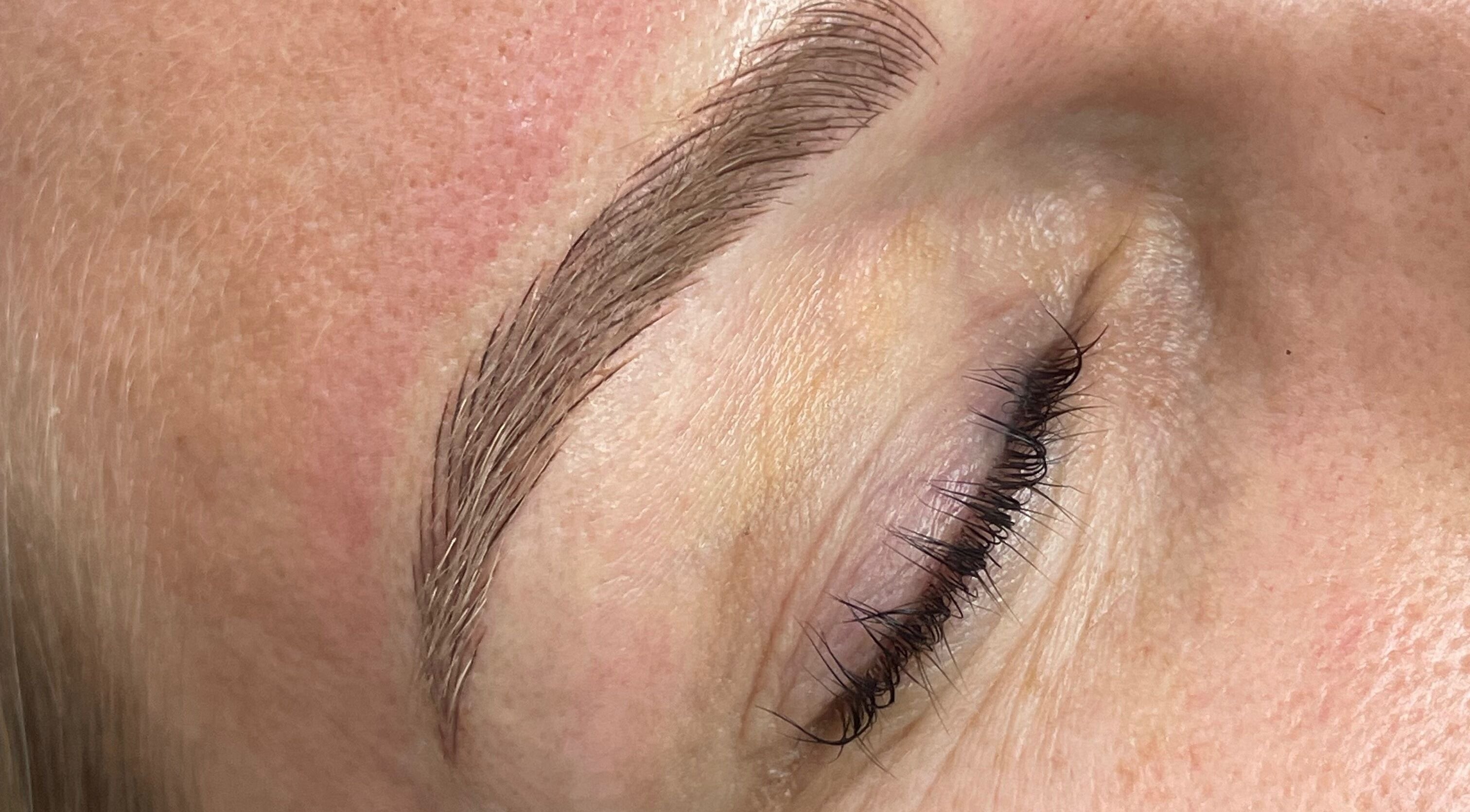 Close-up of professionally groomed eyebrow at Allure Lashes & Aesthetics, Sandton, Gauteng, ZA.