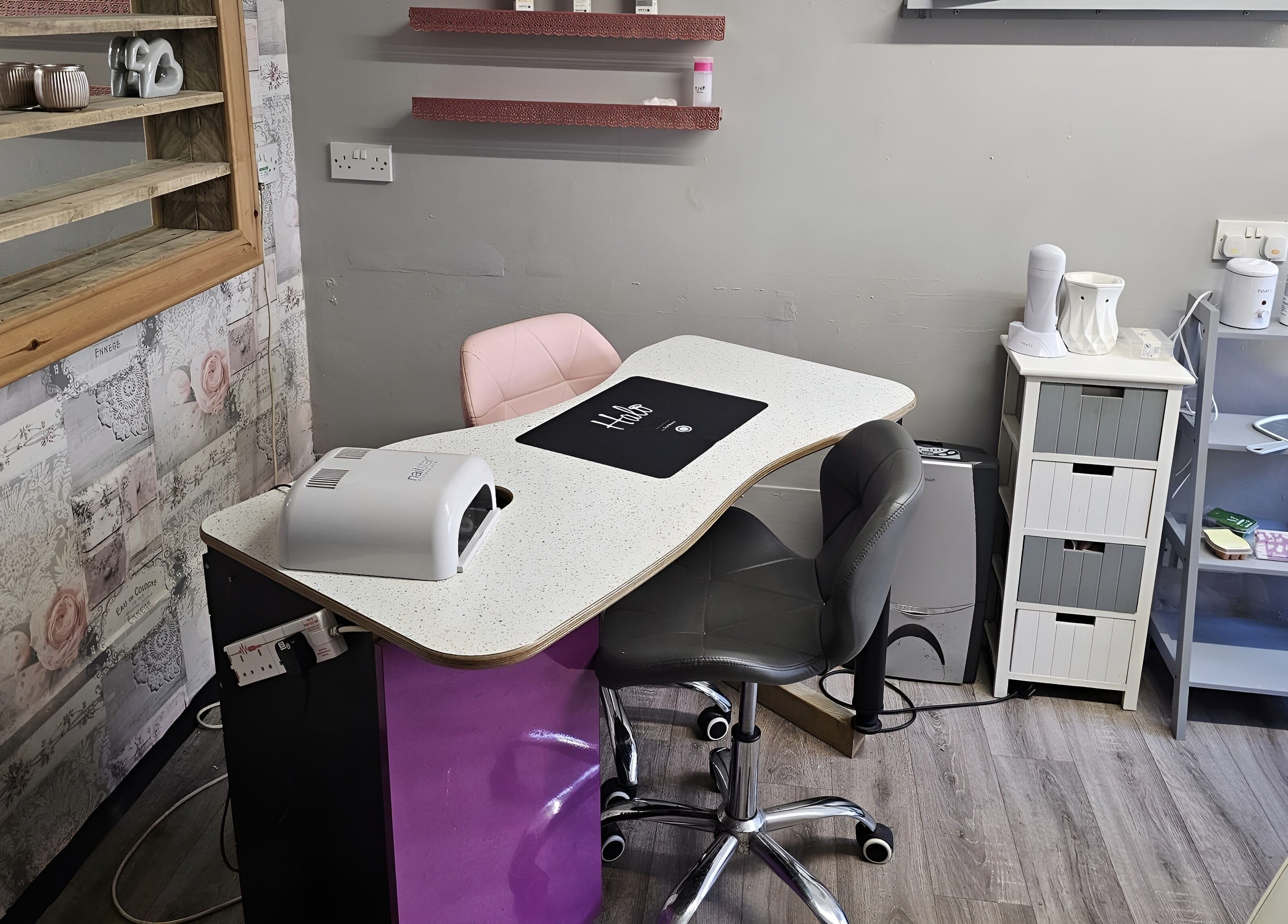 Modern nail station at Colour Chic in Redruth, England, GB showcasing elegant decor and manicure tools.