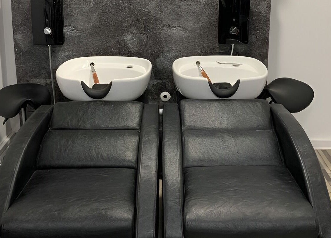 Elegant twin wash stations at Colour Chic salon in Redruth, England, GB for a luxurious hair treatment experience.