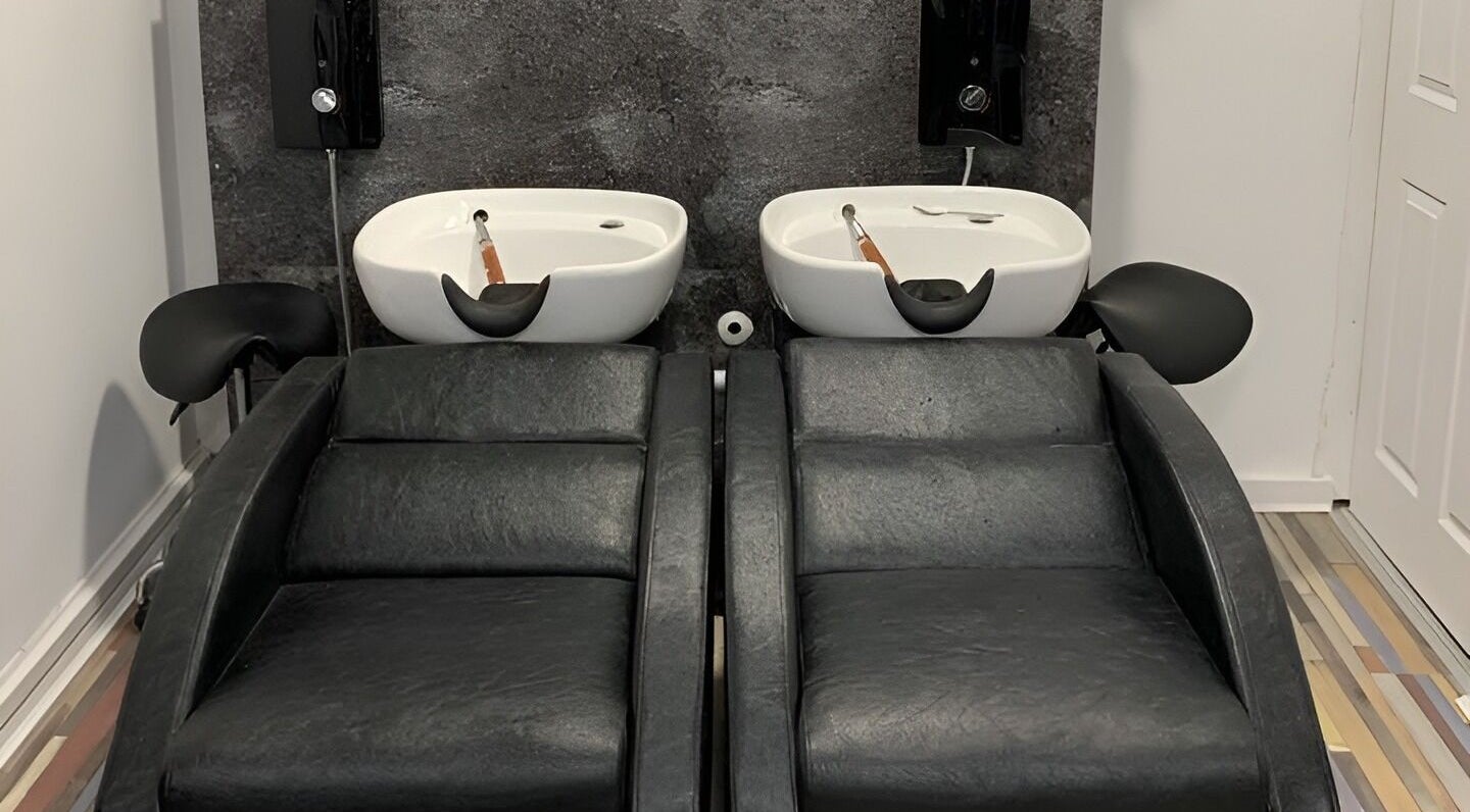 Elegant twin wash stations at Colour Chic salon in Redruth, England, GB for a luxurious hair treatment experience.
