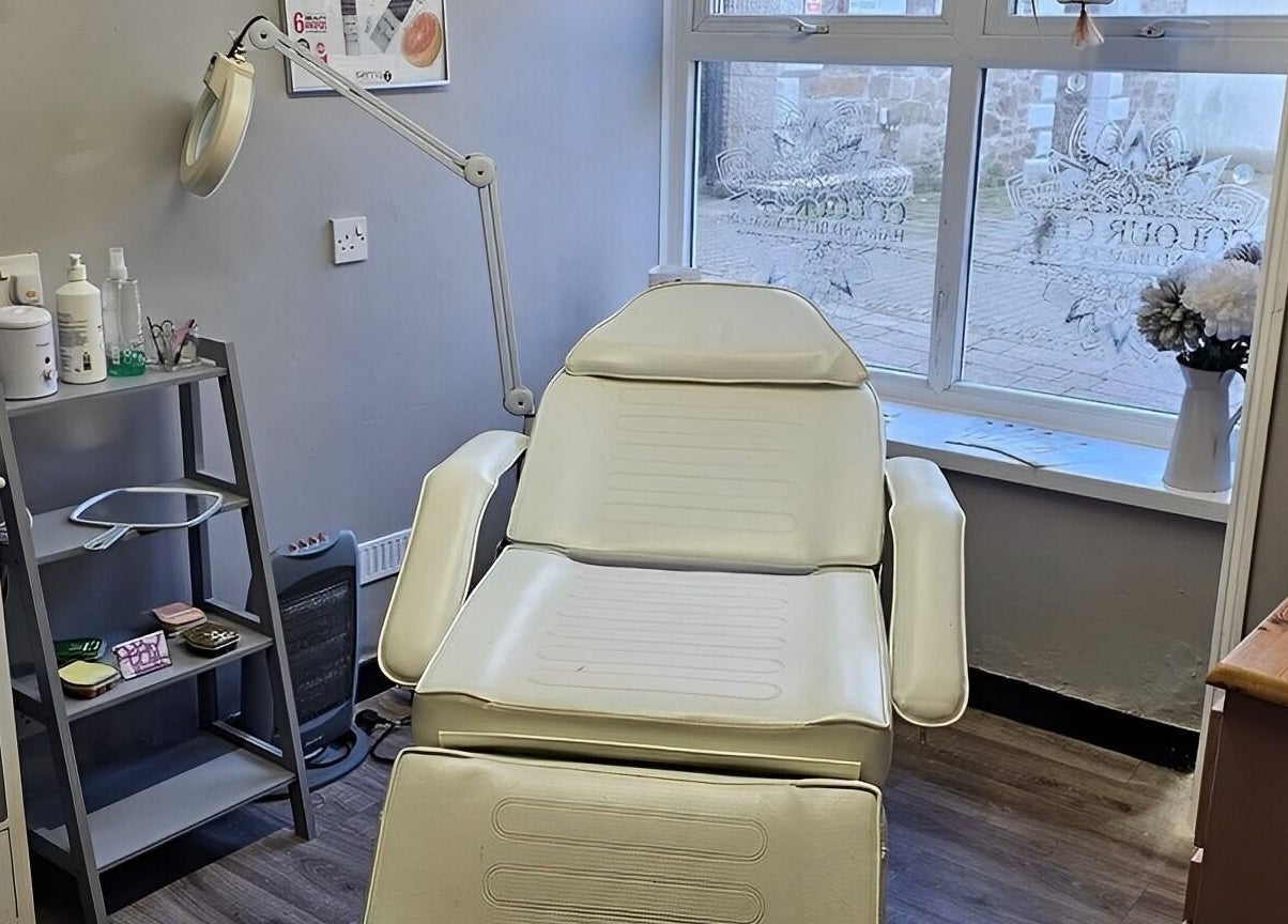 Relaxing treatment room at Colour Chic, Redruth, England, GB, featuring a comfortable recliner and serene decor.