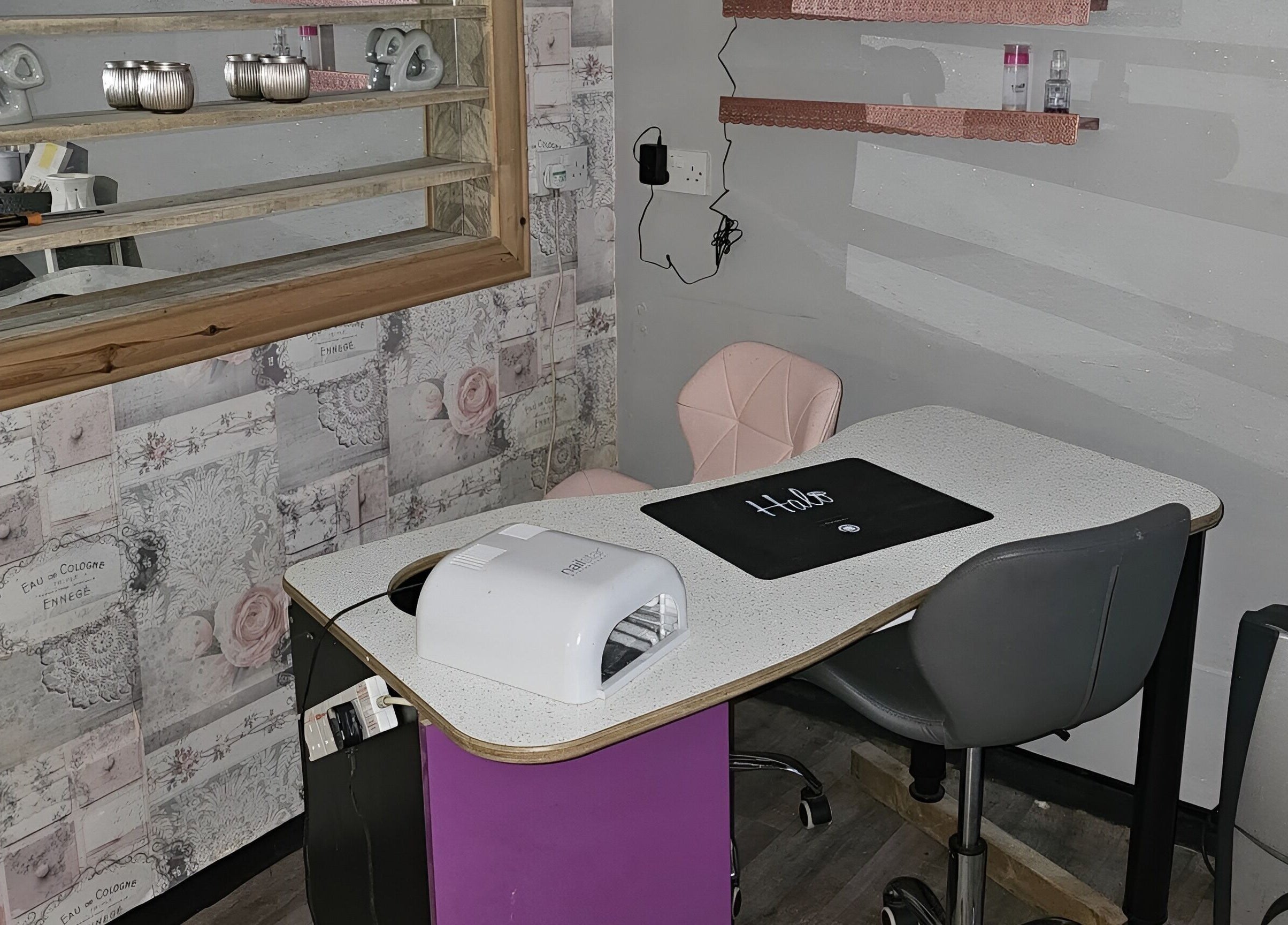 Elegant manicure station at Colour Chic, Redruth, England, GB, with modern decor and cozy seating.