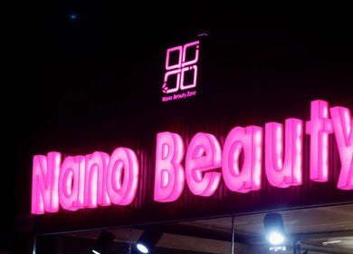 Neon sign of Nano Beauty Zone Salon in Damascus, Damascus Governorate, SY glows at night.