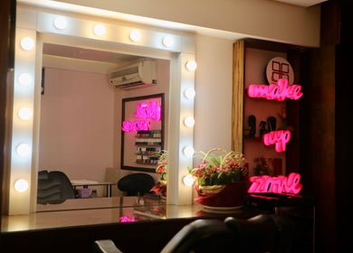 Makeup station at Nano Beauty Zone Salon, Damascus, with vibrant lighting and floral decor.