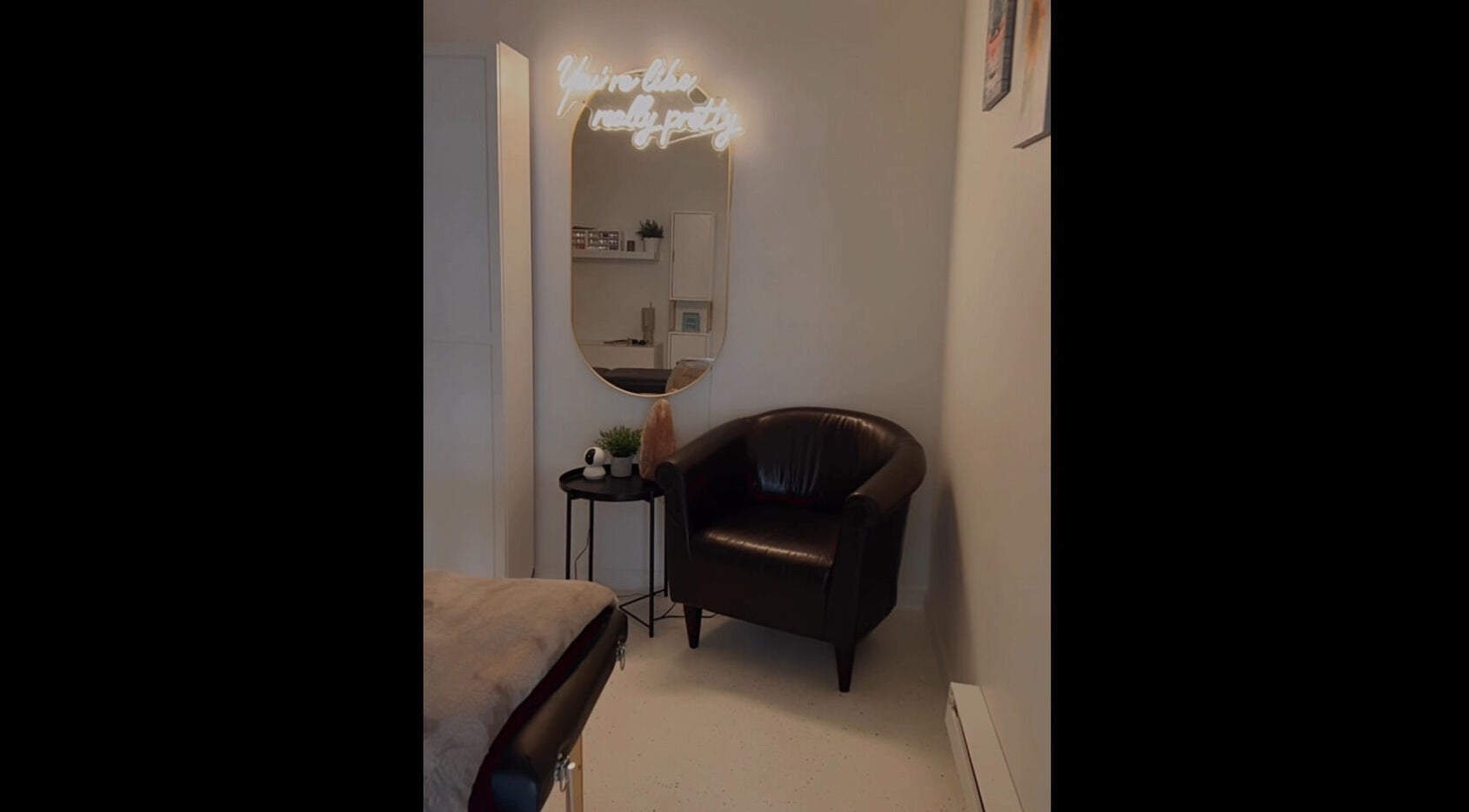 Relaxing corner with a chair and mirror at AFFINITY ARTISTRY DEN, Winnipeg, Manitoba, CA.