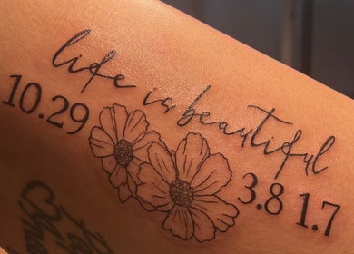 Artistic floral tattoo with text 'Life is beautiful' at AFFINITY ARTISTRY DEN, Winnipeg, Manitoba, CA.
