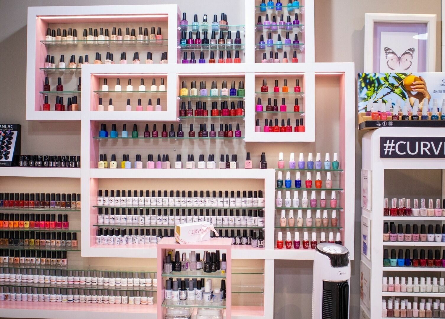 Vibrant nail polish display at Curve Beauty Salon, Dubai, Dubai, AE. A spectrum of colors showcased elegantly.