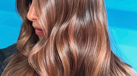 Beautiful sunlit wavy hair at Blue London Hair, London, England, GB.