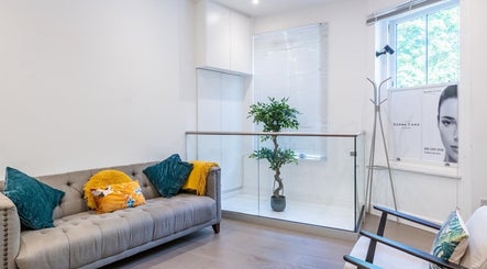 Comfortable waiting area at Waxing London Pro - Battersea, London, England, GB, featuring elegant decor.