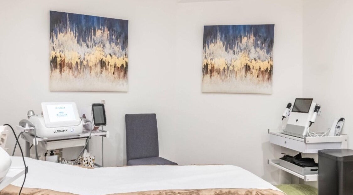 Treatment room at Waxing London Pro - Battersea, London, England, with spa equipment and calming decor.