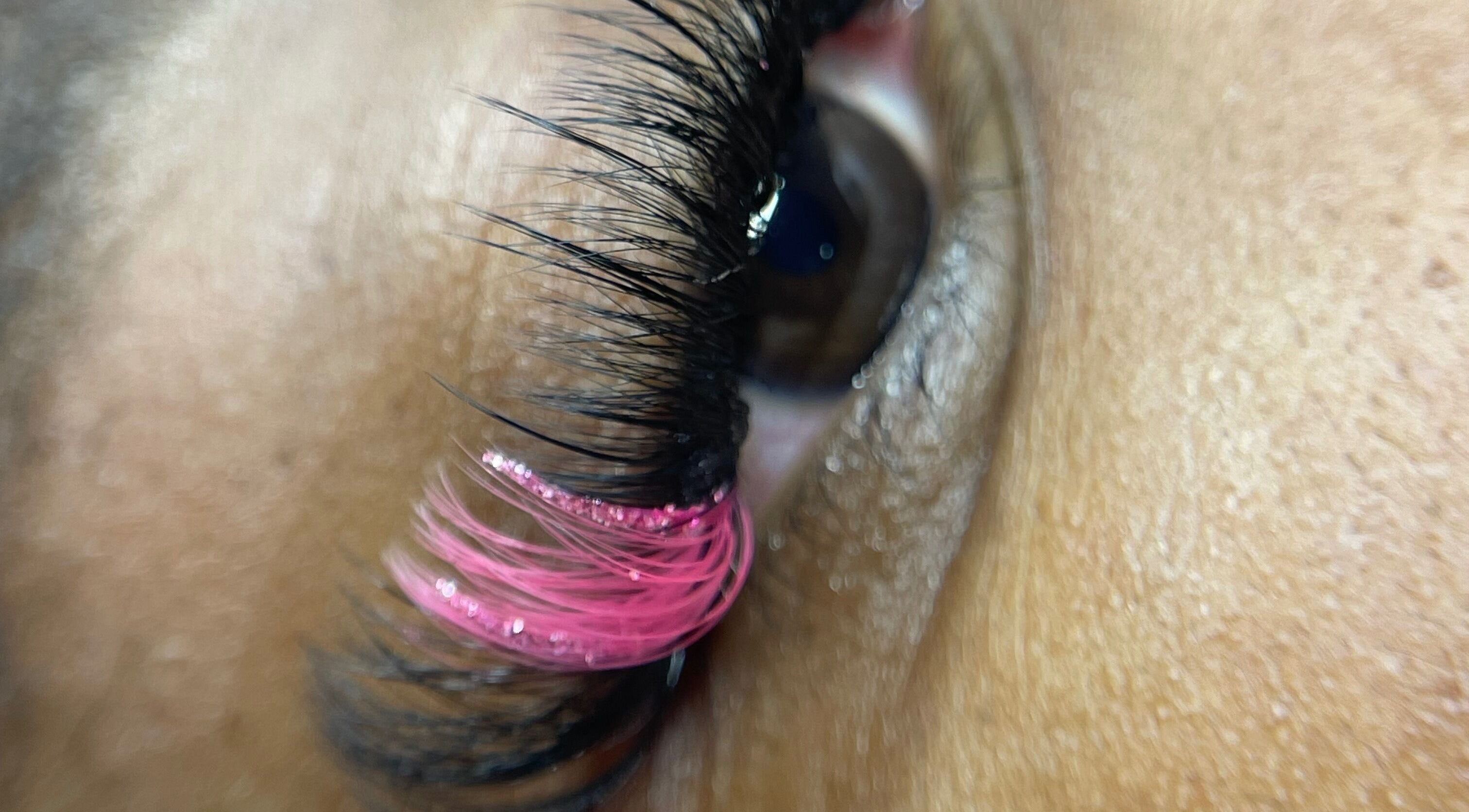 Close-up of eye with pink lash extension at Lashed by Lavern, London, England, GB.