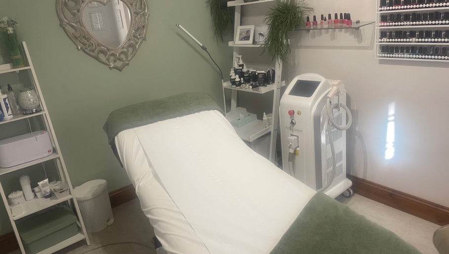 Serenity Beauty therapy room with bed and equipment in Bury St Edmunds, GB.